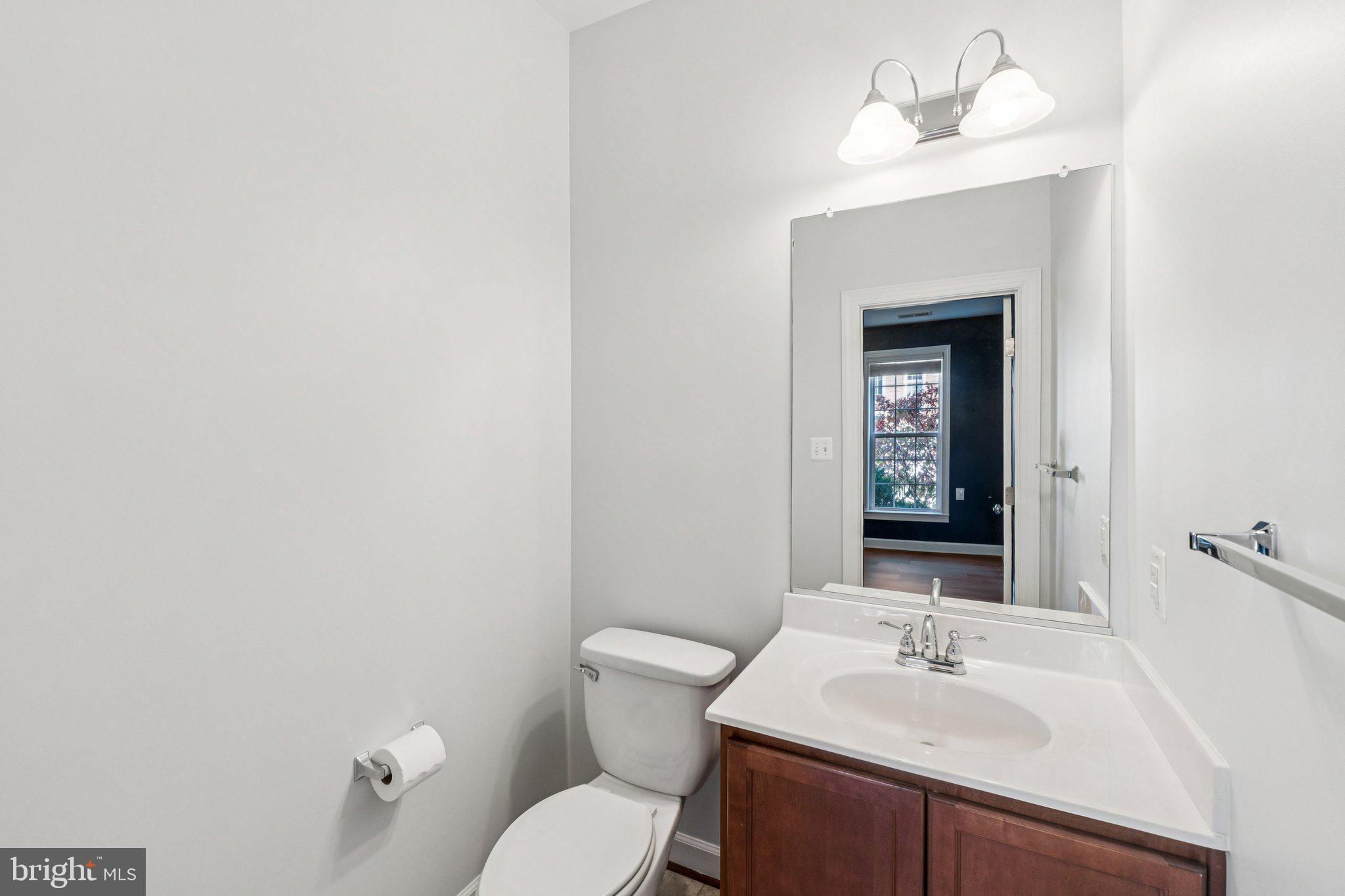 125 Autumn View Drive Gaithersburg, MD 20878 - Photo 33 of 38 a bathroom with a sink vanity mirror and toilet