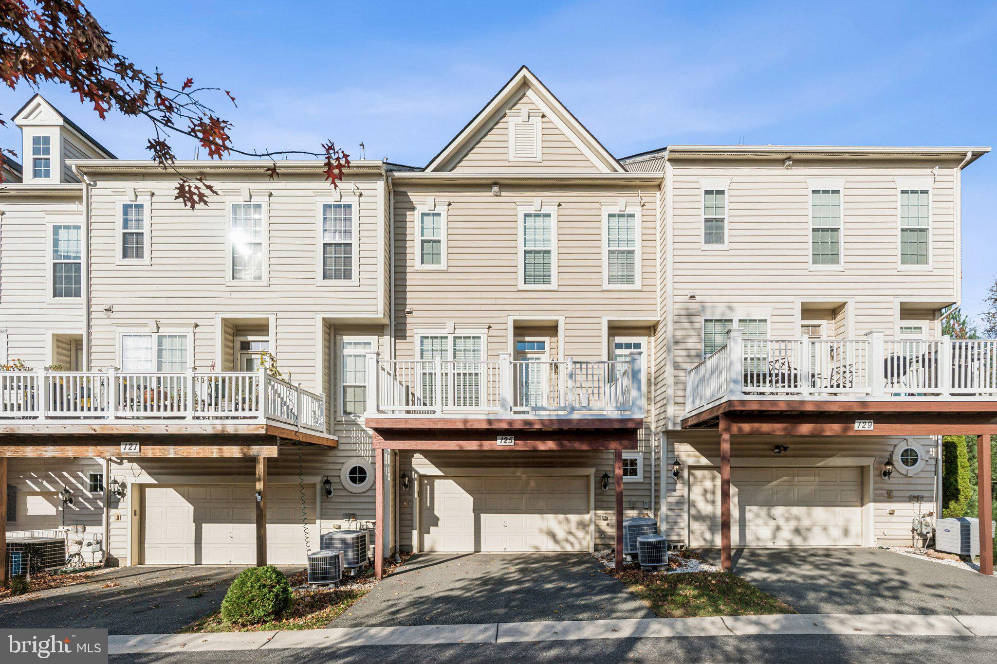 125 Autumn View Drive Gaithersburg, MD 20878 - Photo 35 of 38 a front view of a building with a street