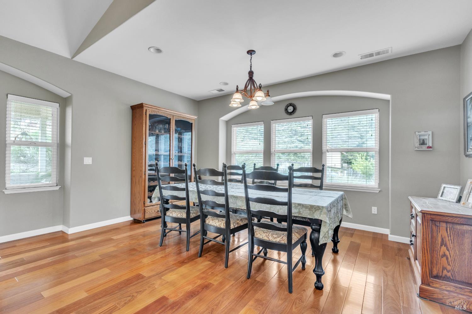 16911 Spruce Grove Road Hidden Valley Lake, CA 95467 - Photo 15 of 39 a view of a dining room with furniture window and wooden floor