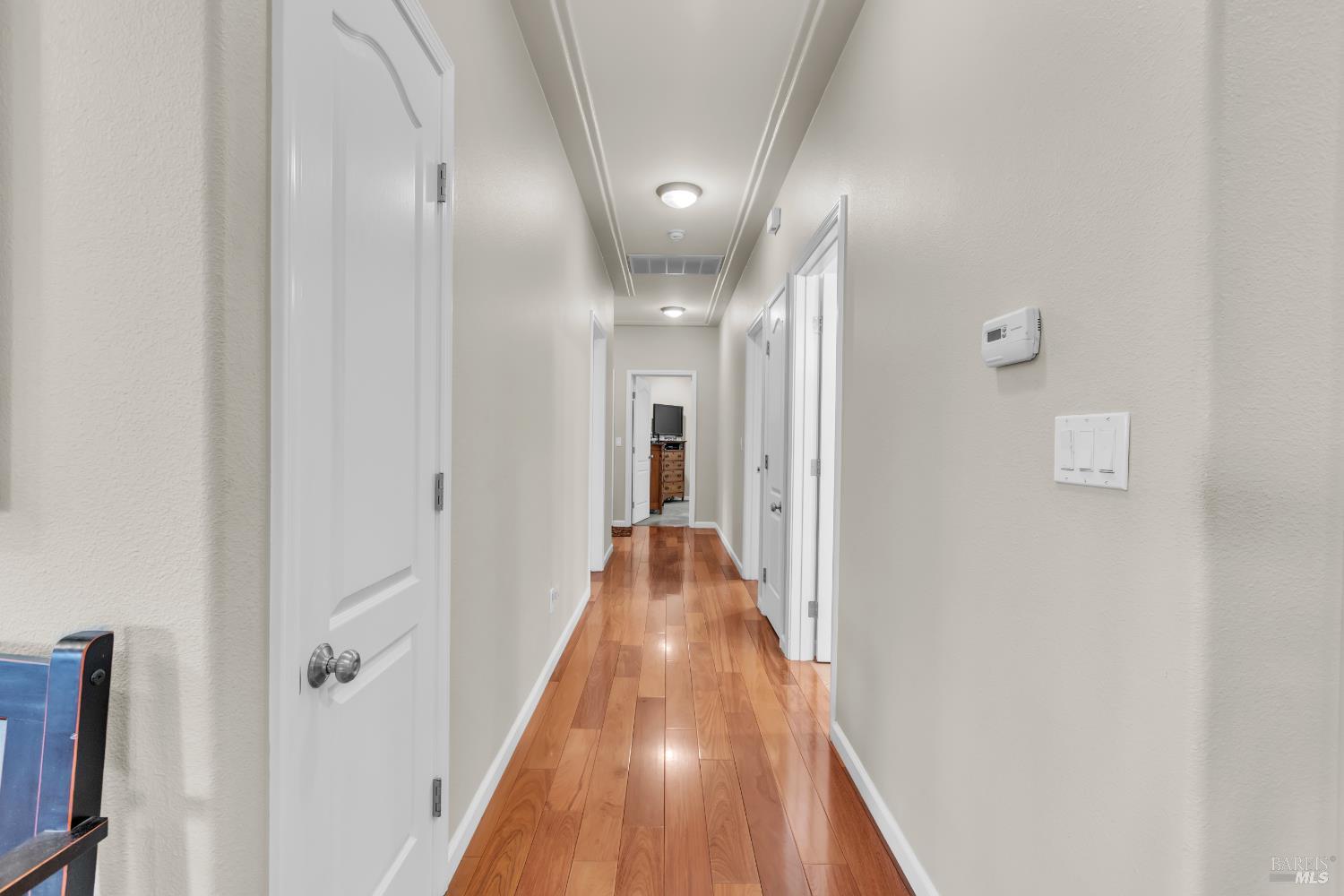 16911 Spruce Grove Road Hidden Valley Lake, CA 95467 - Photo 16 of 39 a view of a hallway with wooden floor and staircase