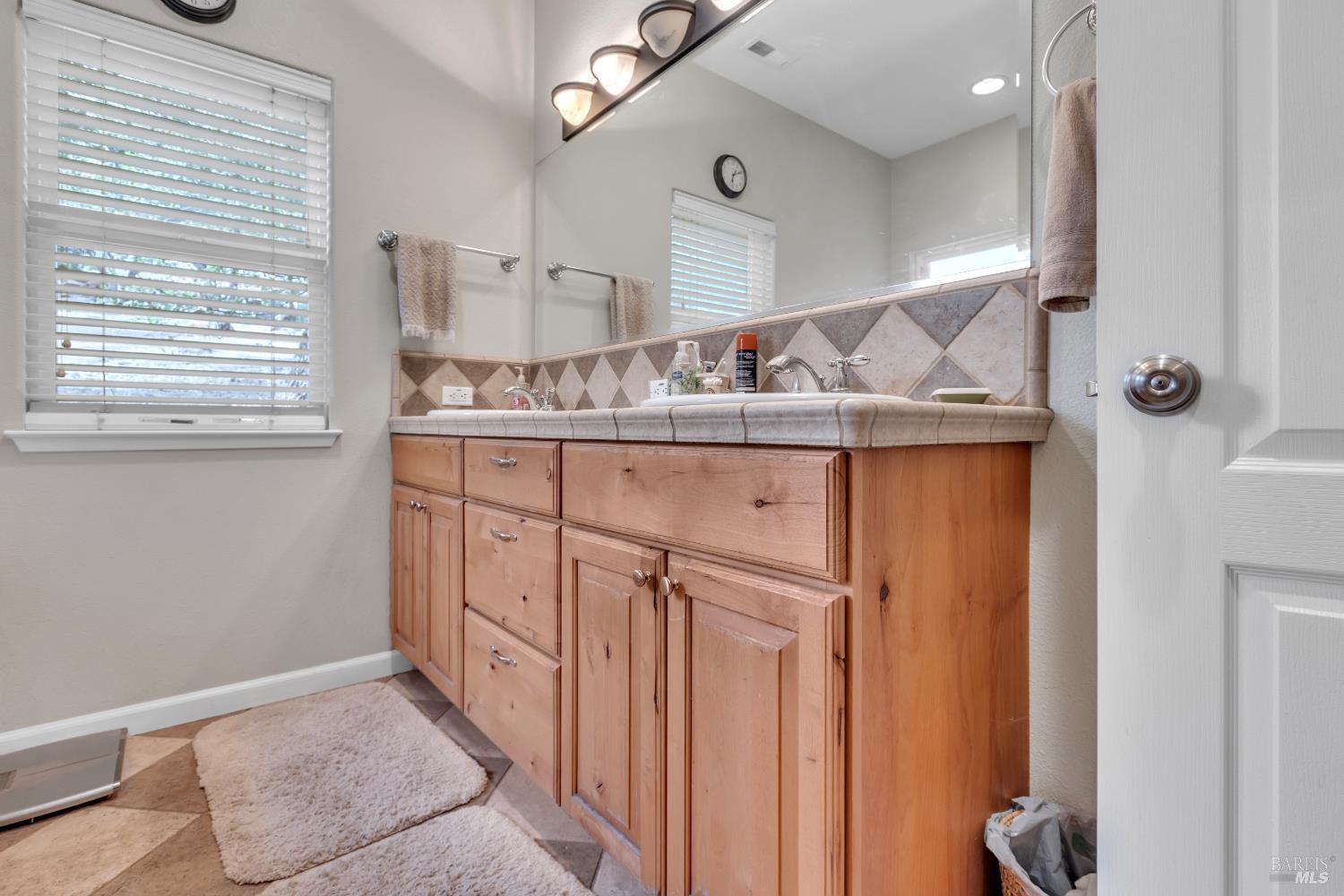 16911 Spruce Grove Road Hidden Valley Lake, CA 95467 - Photo 18 of 39 a kitchen with a sink a refrigerator and window