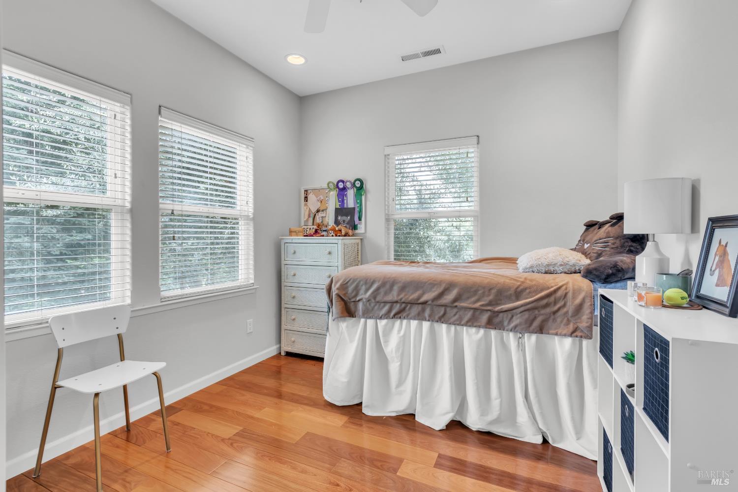 16911 Spruce Grove Road Hidden Valley Lake, CA 95467 - Photo 19 of 39 a bedroom with a bed and a chair
