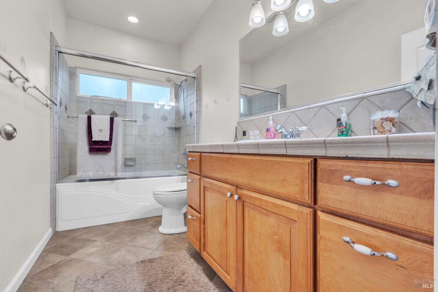 16911 Spruce Grove Road Hidden Valley Lake, CA 95467 - Photo 21 of 39 a bathroom with a sink a toilet and shower