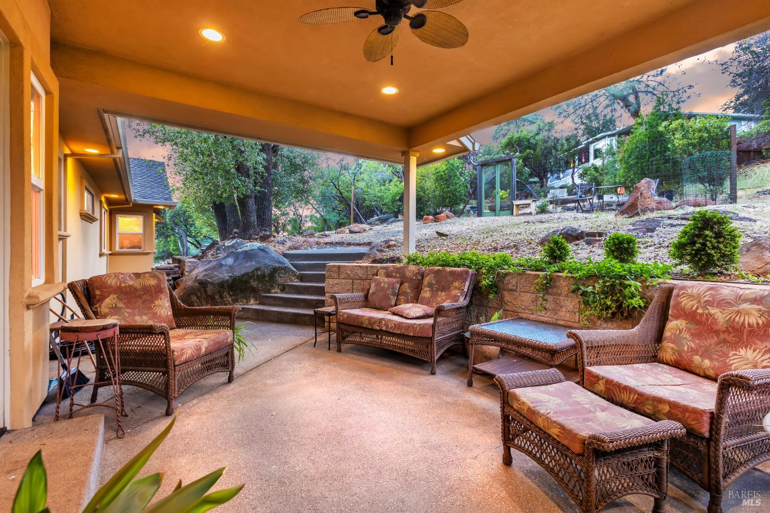16911 Spruce Grove Road Hidden Valley Lake, CA 95467 - Photo 24 of 39 a outdoor living space with furniture potted plant and a large window
