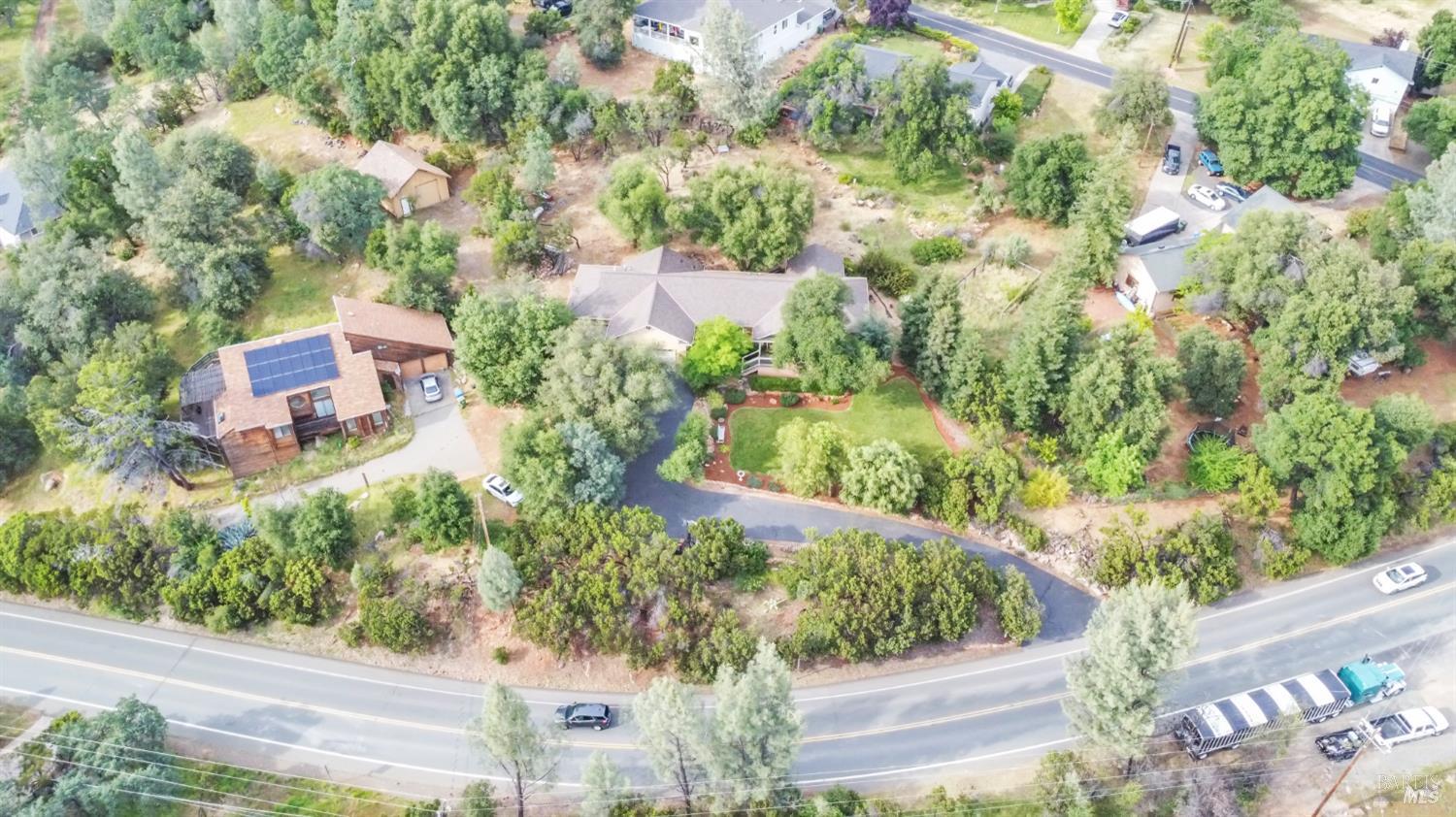 16911 Spruce Grove Road Hidden Valley Lake, CA 95467 - Photo 28 of 39 an aerial view of a house with a yard and garden