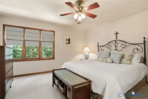 a bedroom with bed and a window