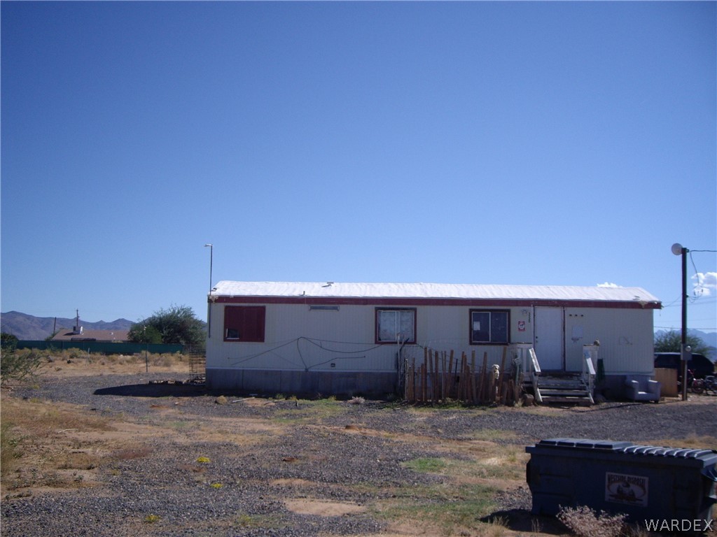 4367 Carrizo Road Golden Valley, AZ 86413 - Photo 1 of 3 a front view of a house with a yard