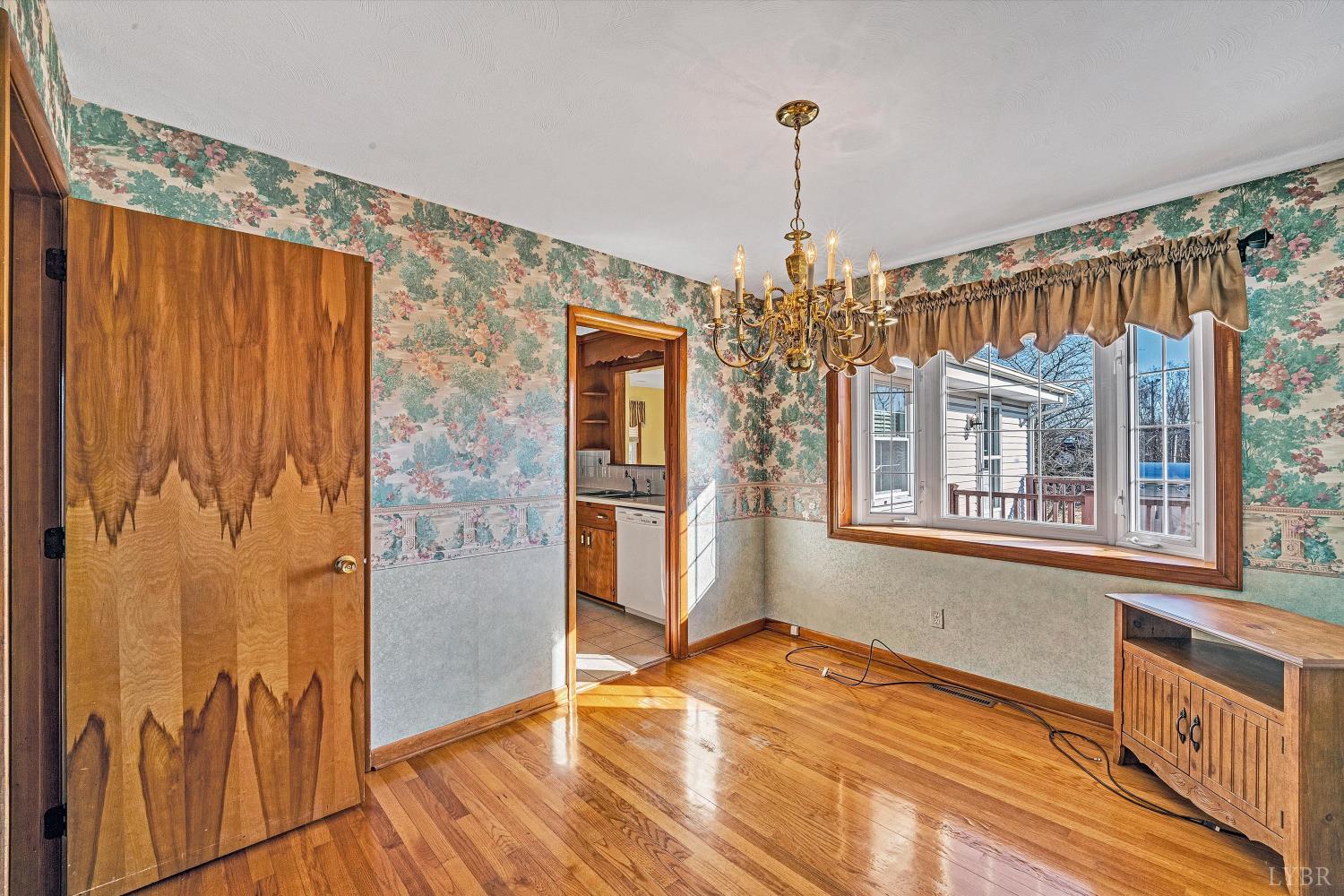1524 Liggates Road Lynchburg, VA 24502 - Photo 14 of 31 an empty room with wooden floor and windows