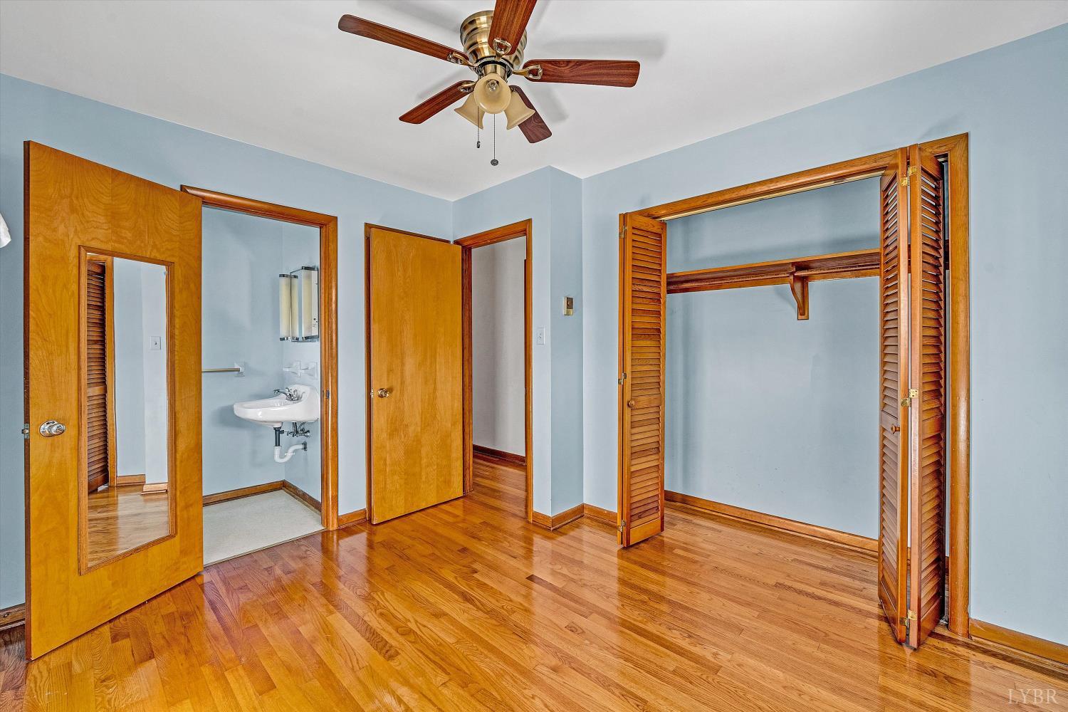 1524 Liggates Road Lynchburg, VA 24502 - Photo 19 of 31 a view of an empty room with wooden floor and a window