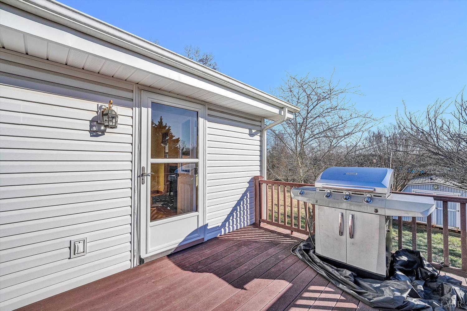 1524 Liggates Road Lynchburg, VA 24502 - Photo 31 of 31 a view of a balcony with furniture and wooden floor