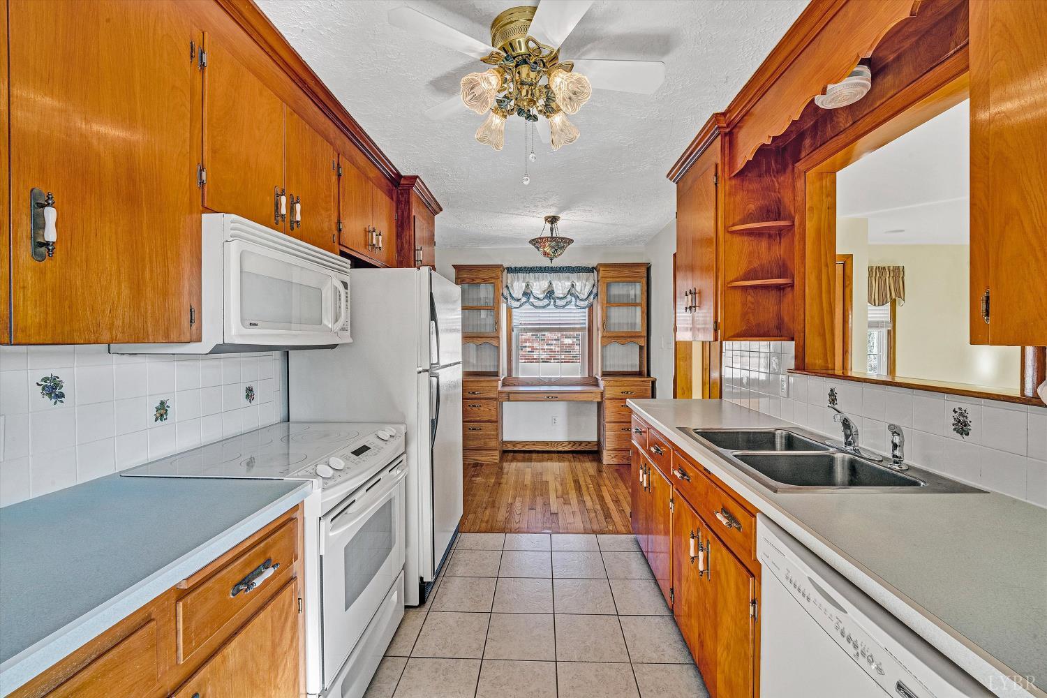 1524 Liggates Road Lynchburg, VA 24502 - Photo 8 of 31 a kitchen with stainless steel appliances a sink stove and cabinets