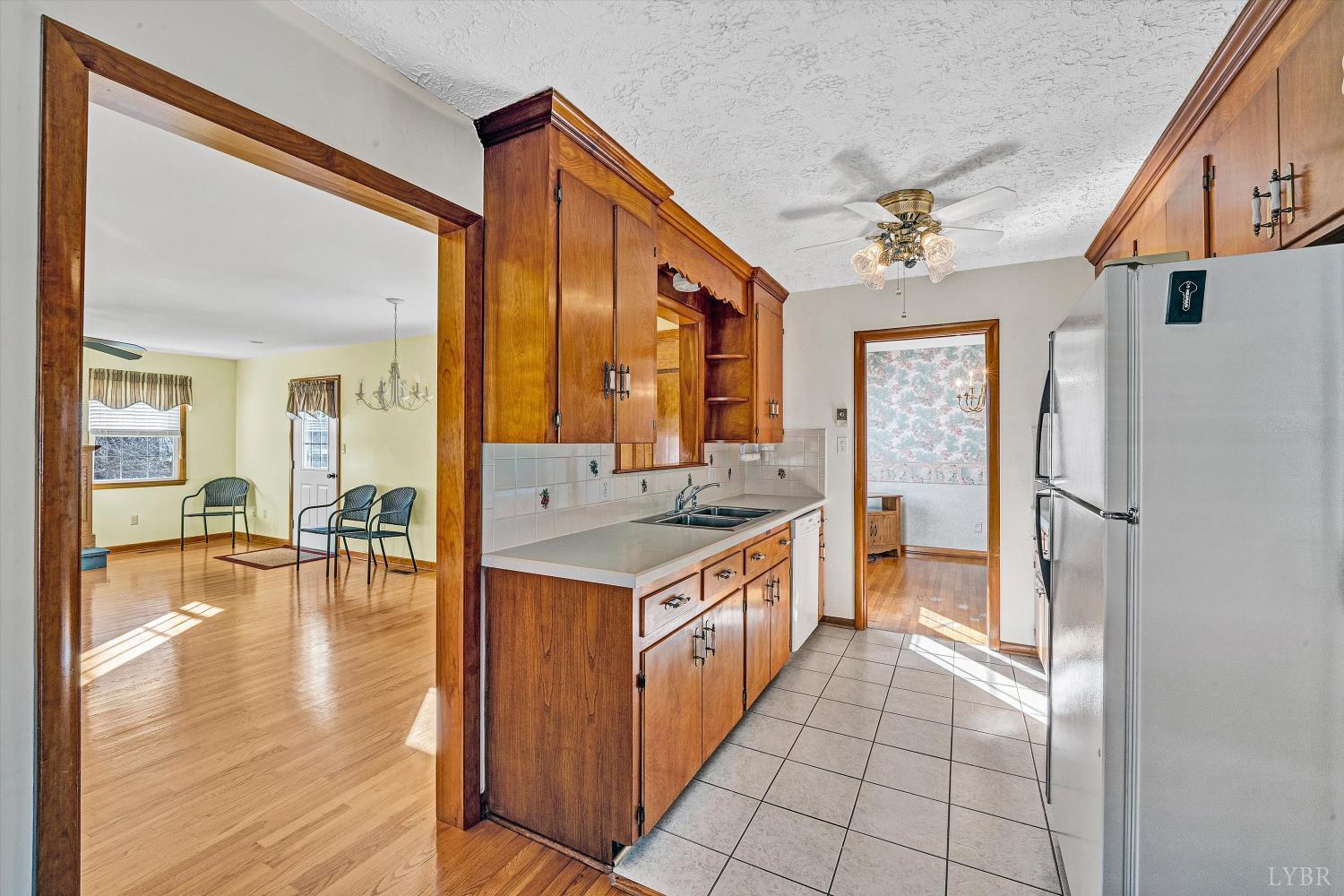 1524 Liggates Road Lynchburg, VA 24502 - Photo 9 of 31 a kitchen with stainless steel appliances granite countertop a refrigerator and a sink