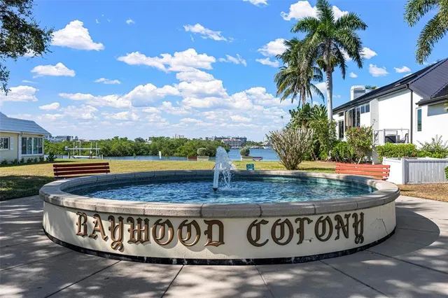 a view of a house with swimming pool and sitting area