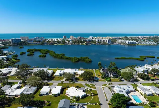 a front view of a house with garden and porch