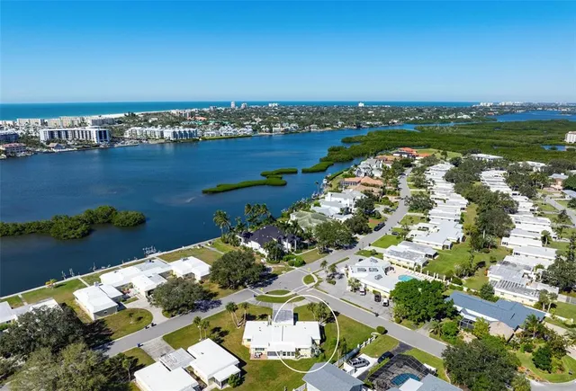 a room with lots of furniture and a book shelf