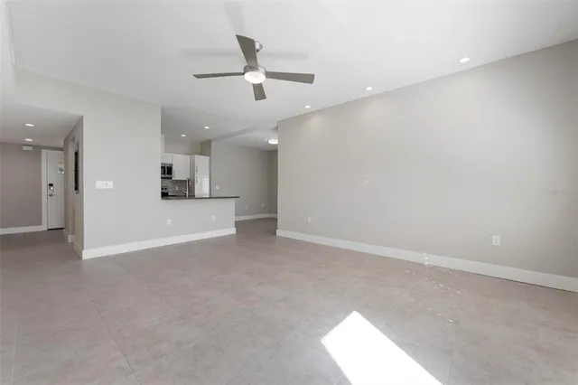 a kitchen with stainless steel appliances a refrigerator and a stove top oven