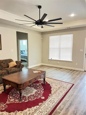 a living room with a couch and a rug