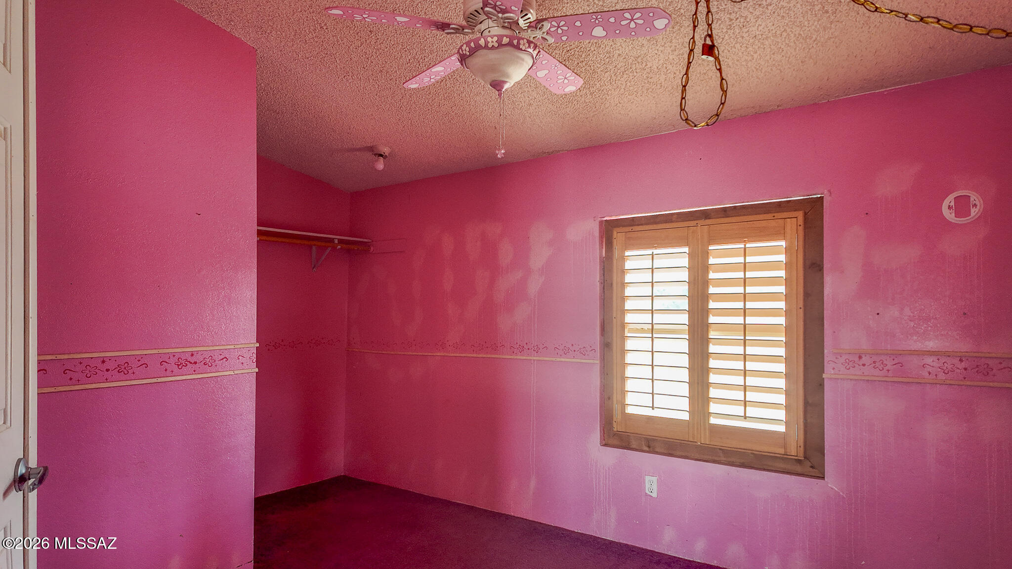 27651 South Canoa Road Amado, AZ 85645 - Photo 12 of 20 a view of a livingroom with a window and a ceiling fan
