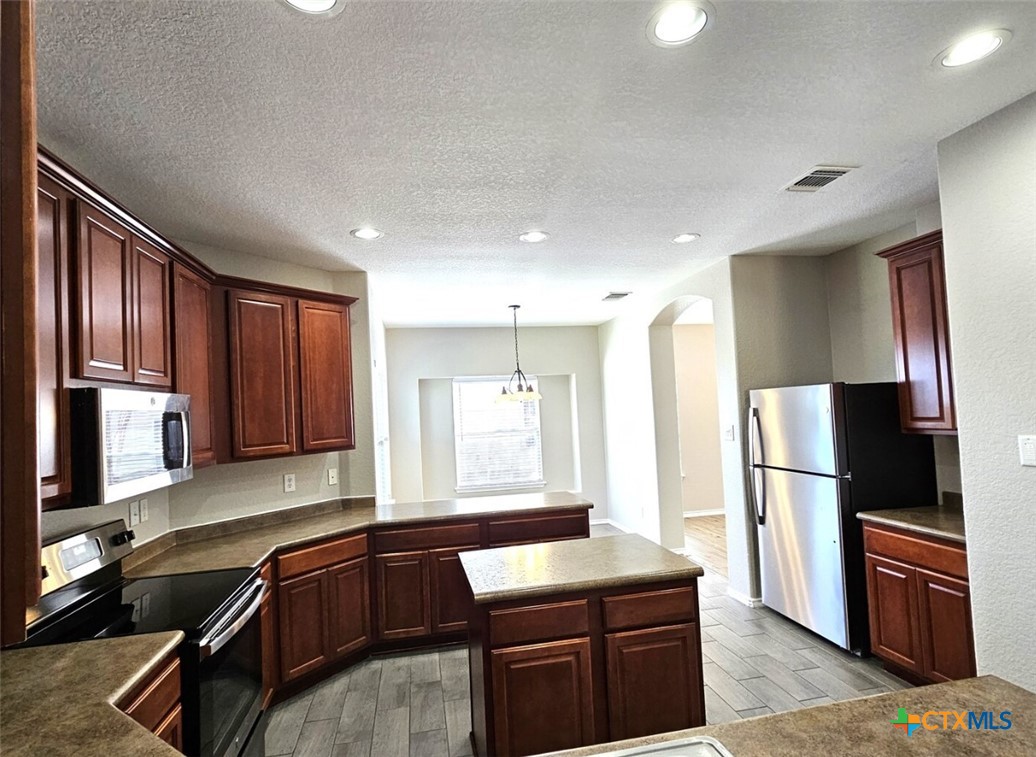 316 Julian Point Cibolo, TX 78108 - Photo 4 of 28 a kitchen with a refrigerator stove and sink
