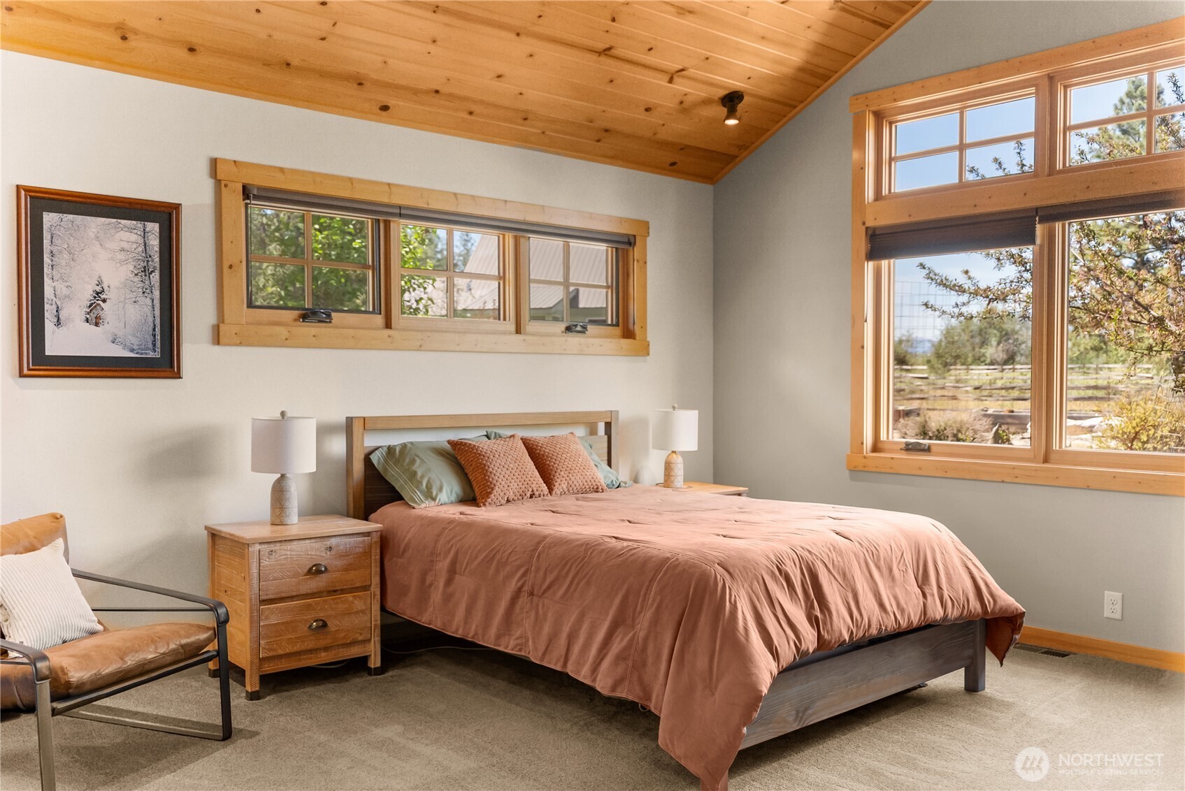 130 Sundown Road Winthrop, WA 98862 - Photo 18 of 40 a bedroom with a bed and a large window