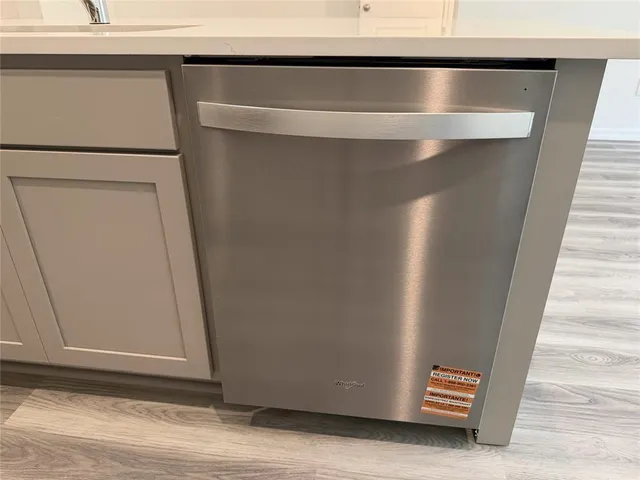 a kitchen with stainless steel appliances a refrigerator a sink a stove and microwave