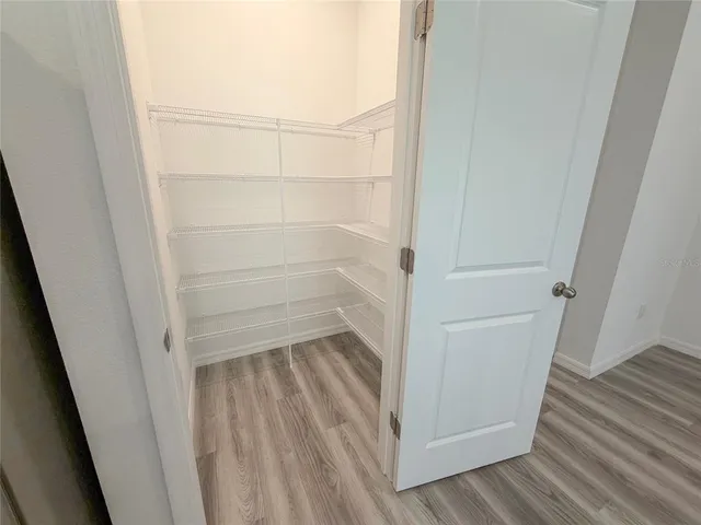 a bathroom with a sink mirror and toilet