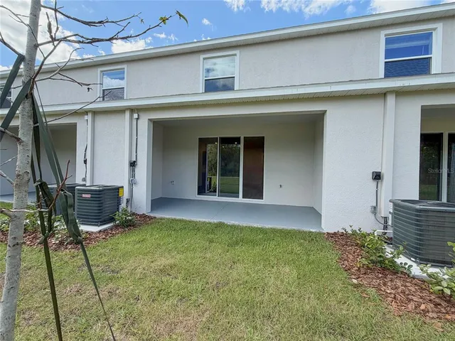 a view of kitchen with sink microwave and refrigerator