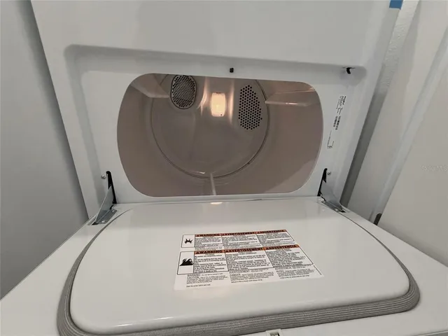 a view of a swimming pool and lounge chairs