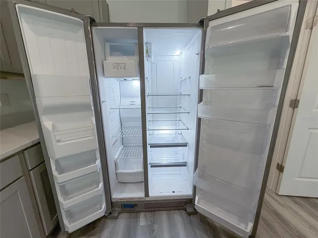 a stove top oven sitting inside of a kitchen