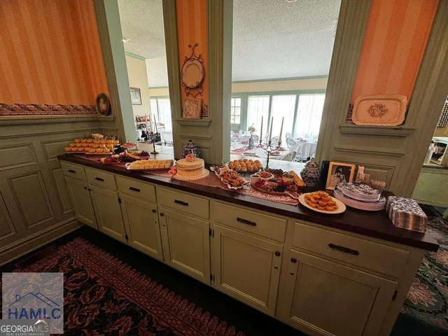 a room with stainless steel appliances a sink and a window