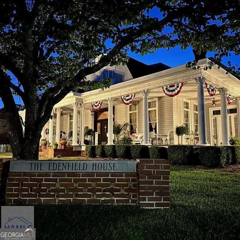 a front view of a building with garden