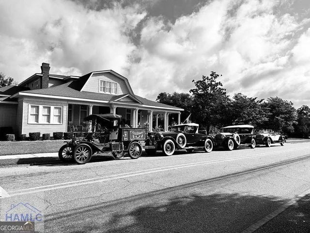 a view of a car parked in front of a house
