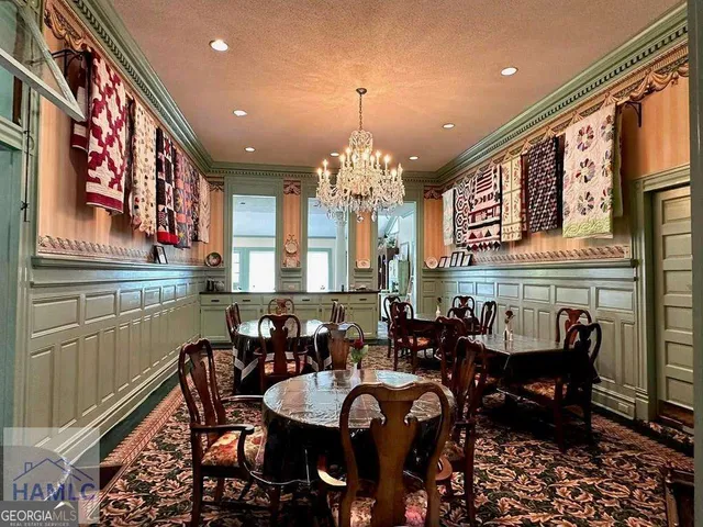 a view of a a dining room with furniture window and outside view