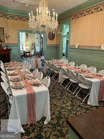 a dinning table and chairs in a open kitchen