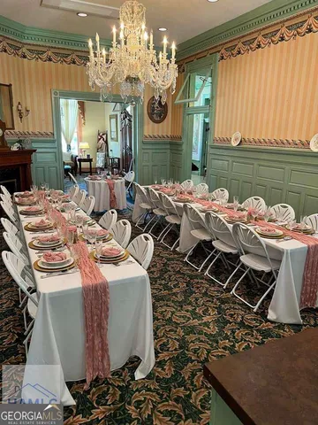 a dinning table and chairs in a open kitchen