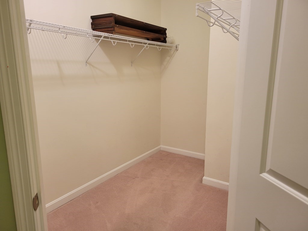 9 Abigail Way, Unit 4010 Reading, MA 01867 - Photo 20 of 37 a view of small space with racks on the wall