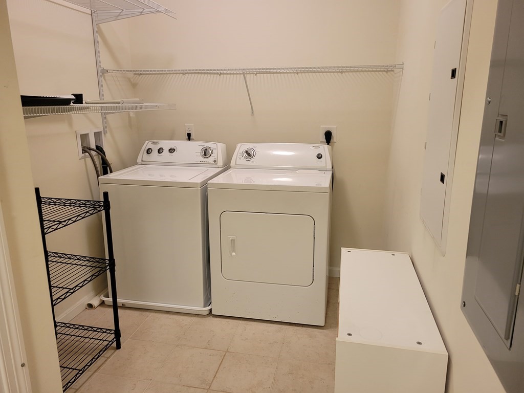 9 Abigail Way, Unit 4010 Reading, MA 01867 - Photo 23 of 37 a utility room with dryer and washer