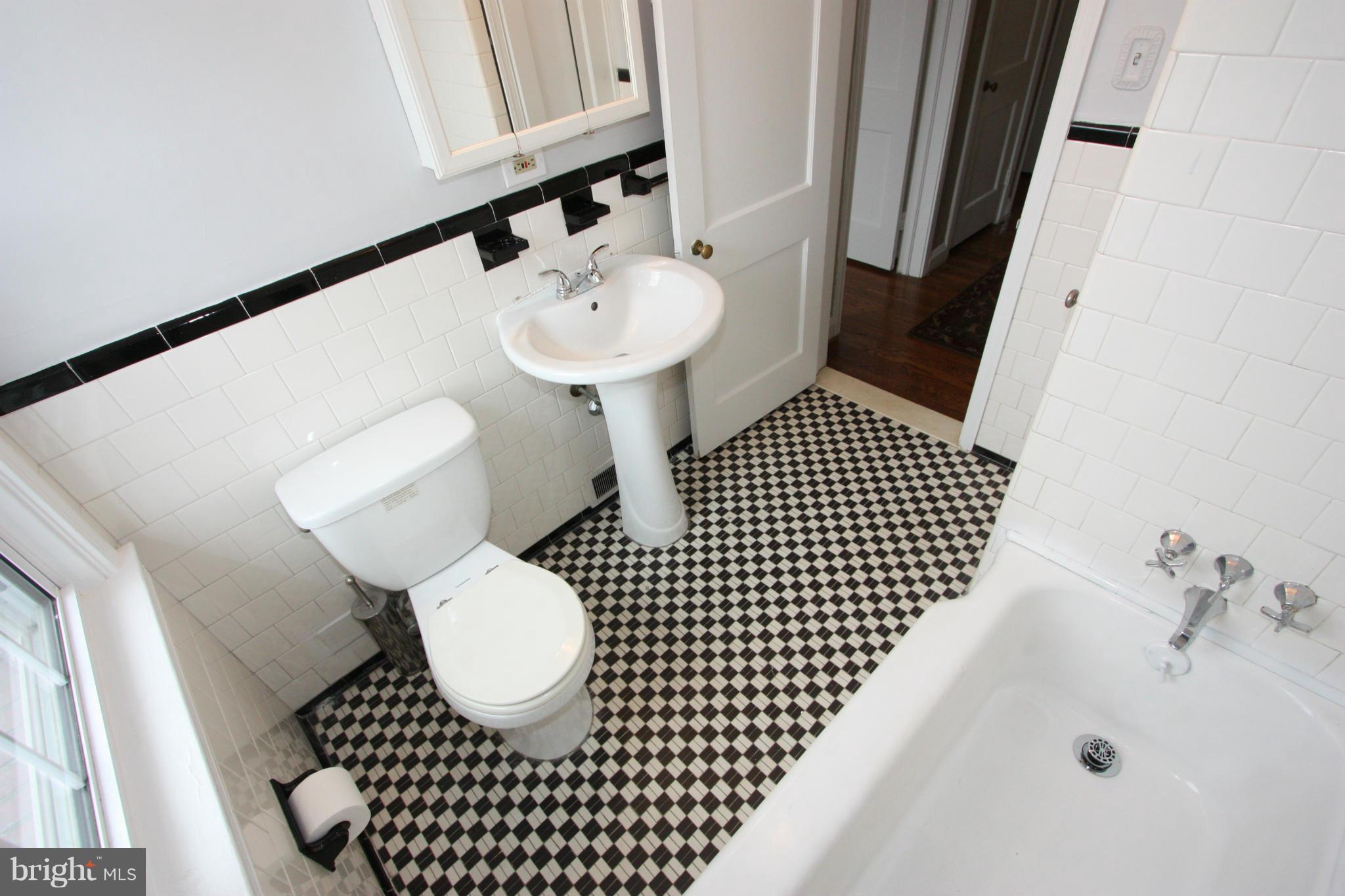 1932 Edgewood Road Parkville, MD 21286 - Photo 19 of 30 a bathroom with a sink toilet and shower