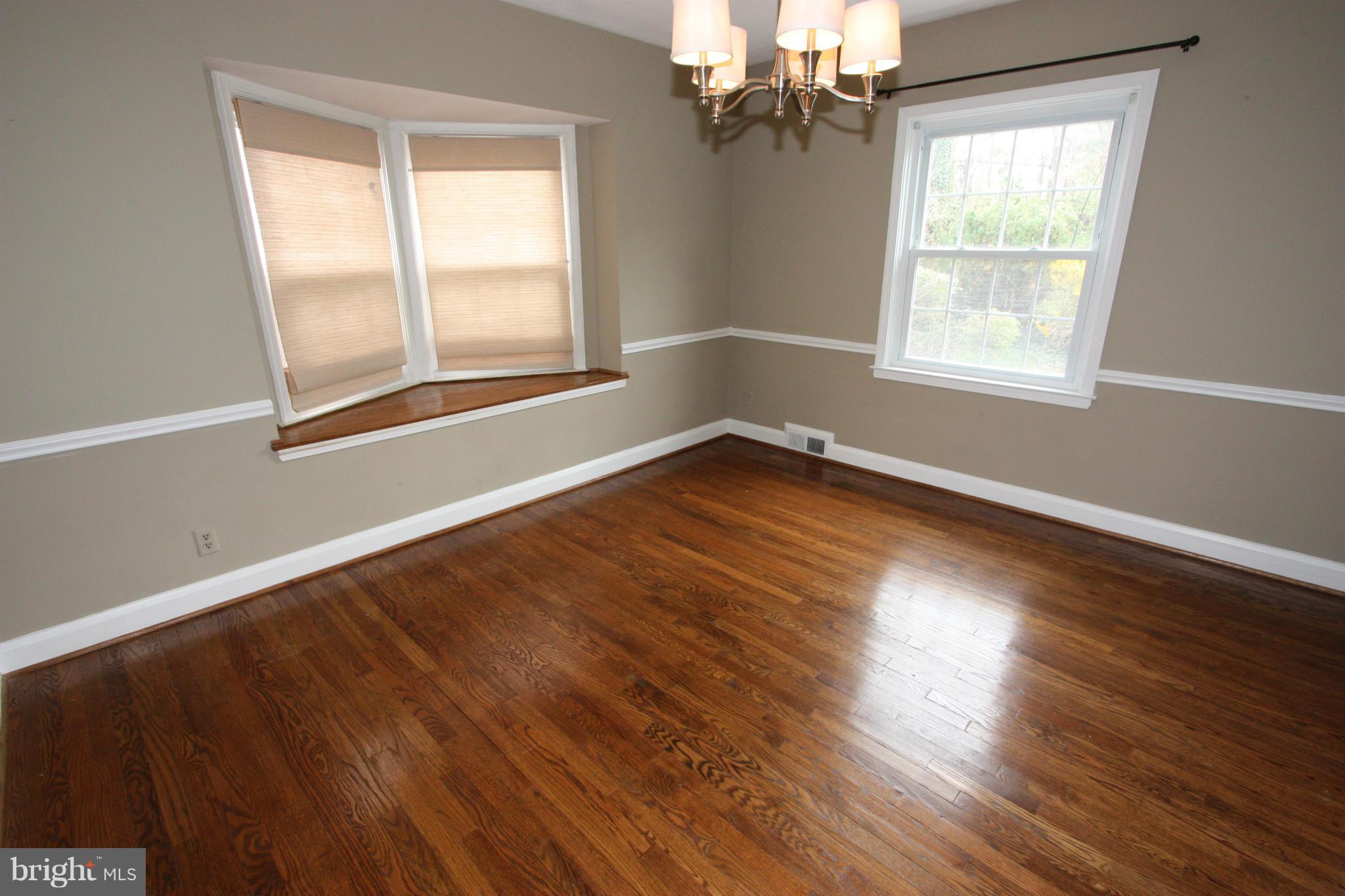 1932 Edgewood Road Parkville, MD 21286 - Photo 8 of 30 a view of an empty room with wooden floor and a window