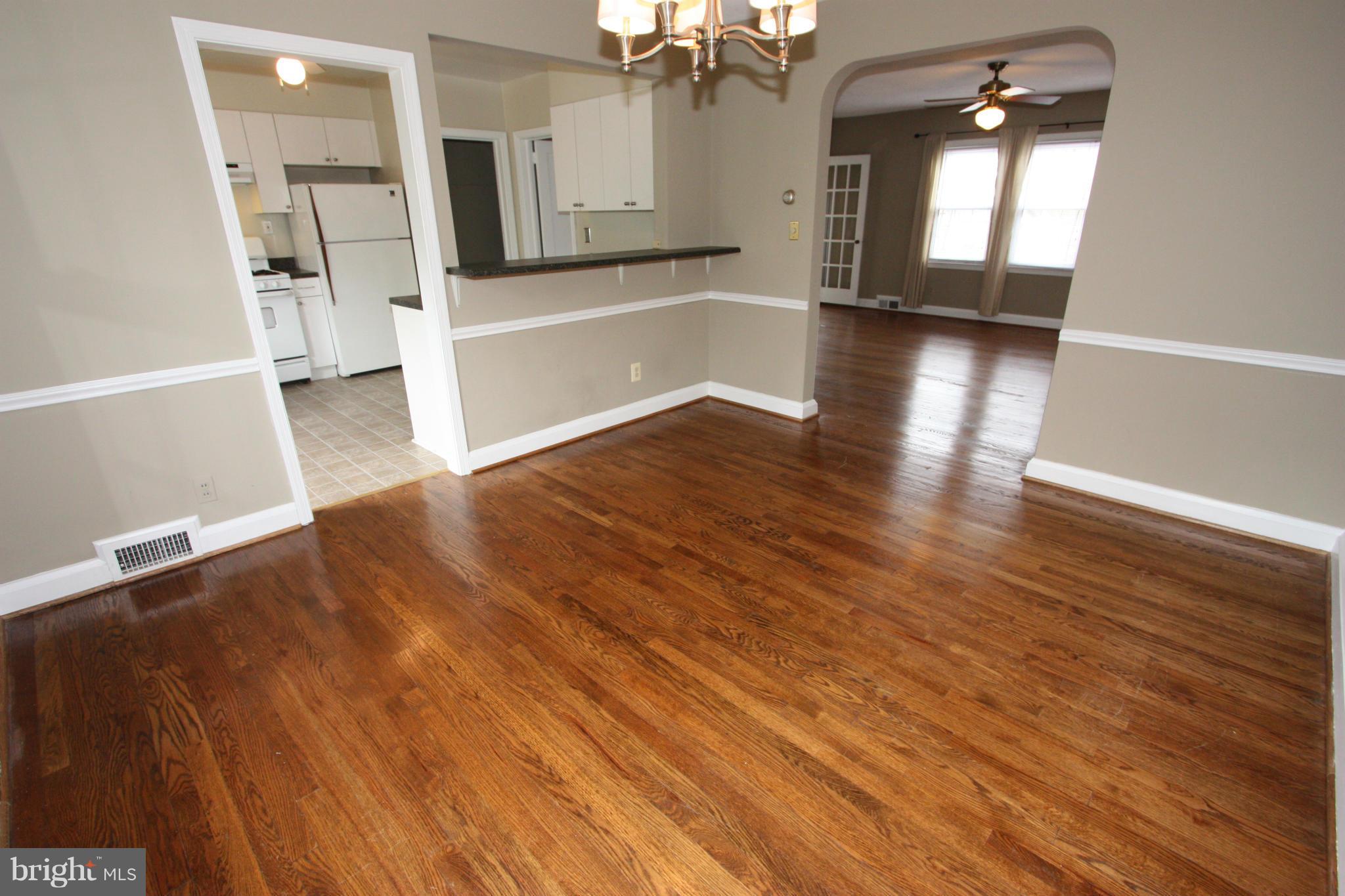 1932 Edgewood Road Parkville, MD 21286 - Photo 10 of 30 wooden floor in an empty room with a window
