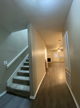 a view of a kitchen with a sink and a stove top oven