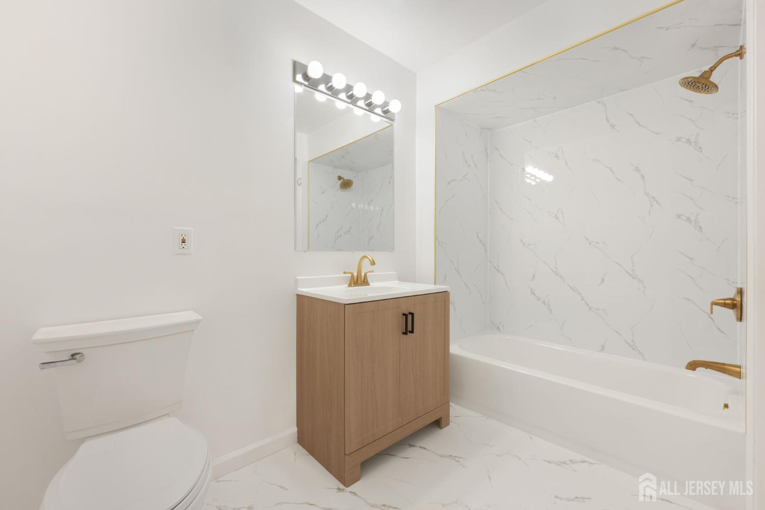 102 Raintree Court Helmetta, NJ 08828 - Photo 17 of 21 a bathroom with a sink a toilet and shower