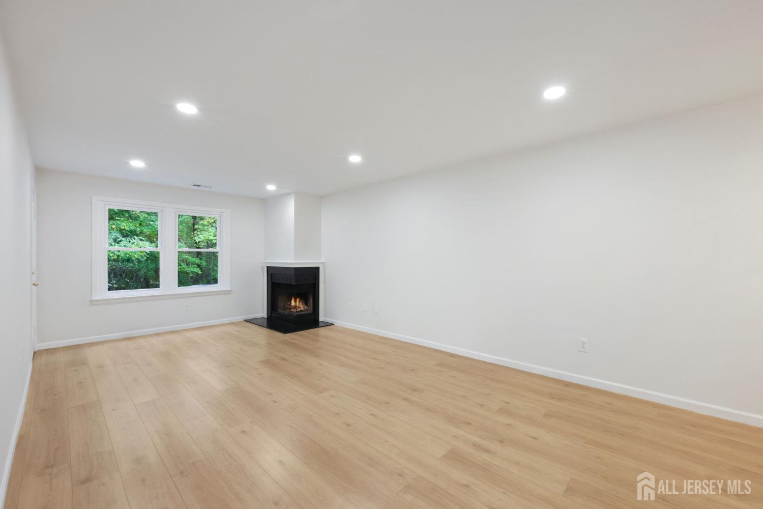102 Raintree Court Helmetta, NJ 08828 - Photo 4 of 21 a view of a big room with windows and chandelier
