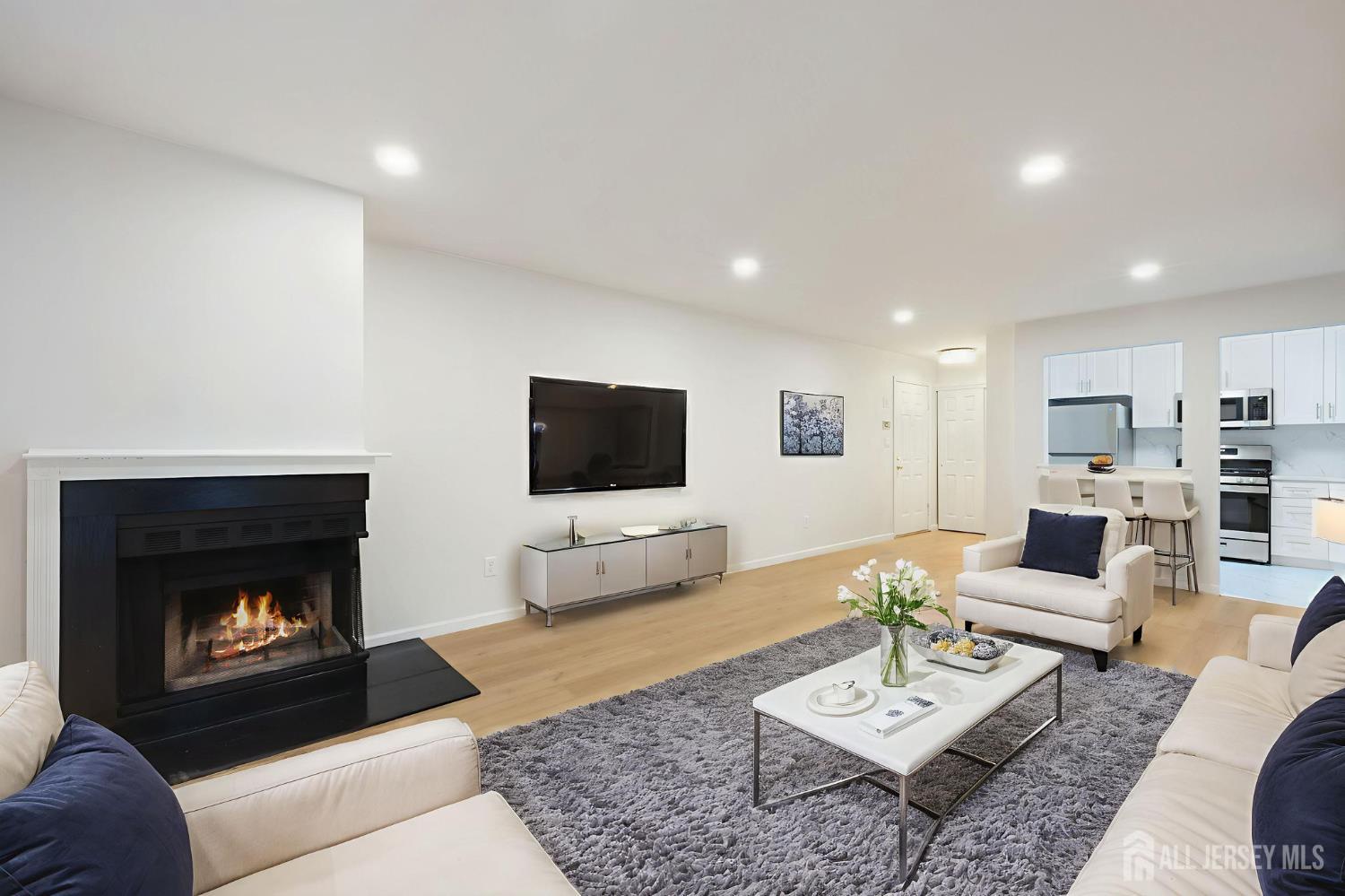 102 Raintree Court Helmetta, NJ 08828 - Photo 6 of 21 a living room with furniture and a fireplace