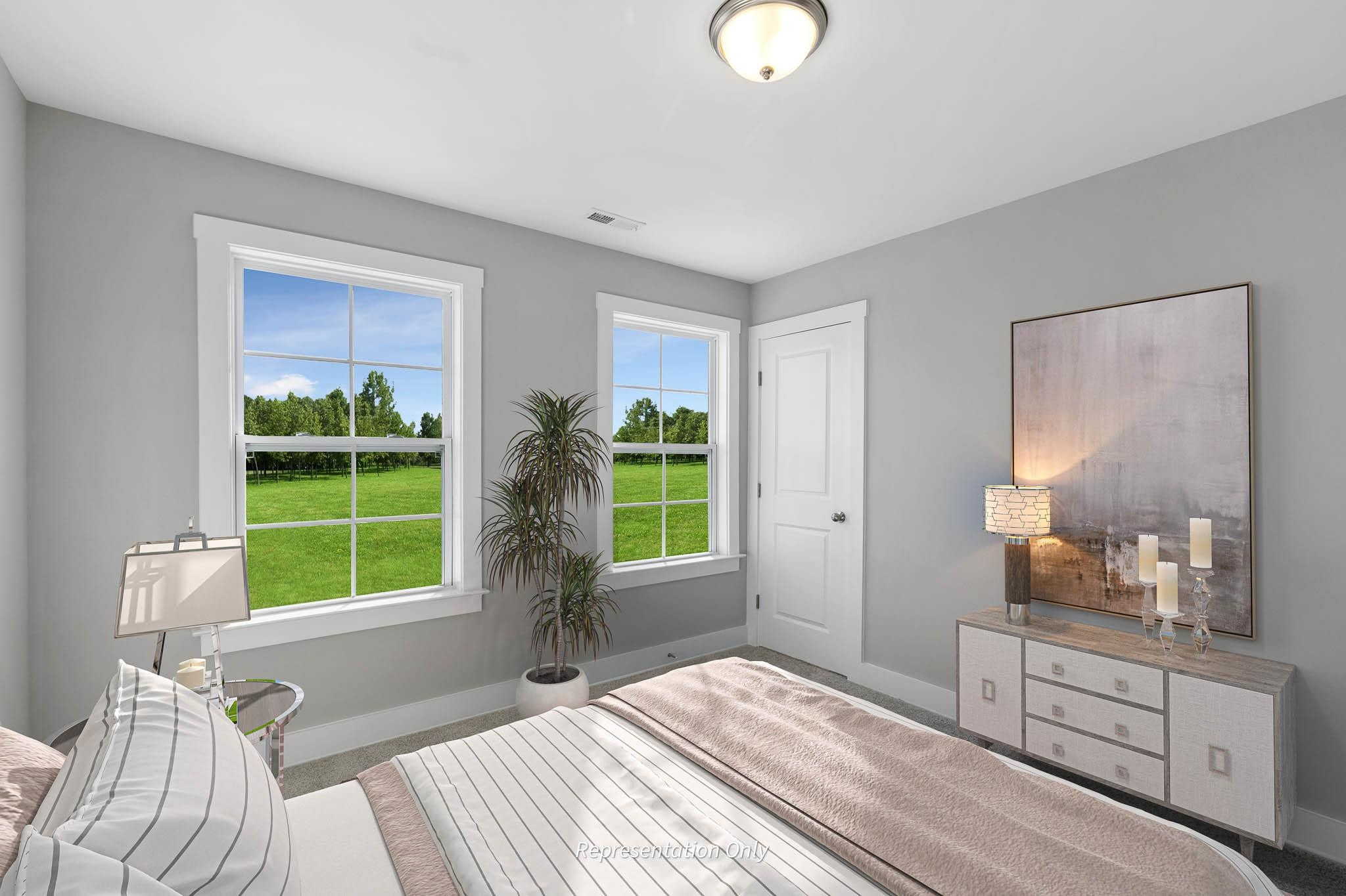 8720 Maxine Street, Unit 3 Willow Spring, NC 27592 - Photo 32 of 35 a bedroom with a bed and a window