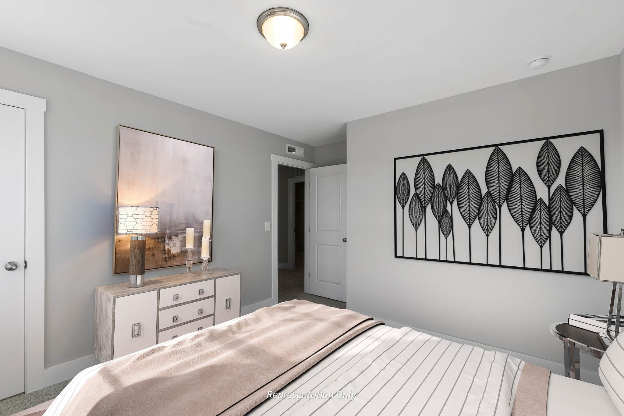 8720 Maxine Street, Unit 3 Willow Spring, NC 27592 - Photo 33 of 35 a bedroom with a large bed and a window