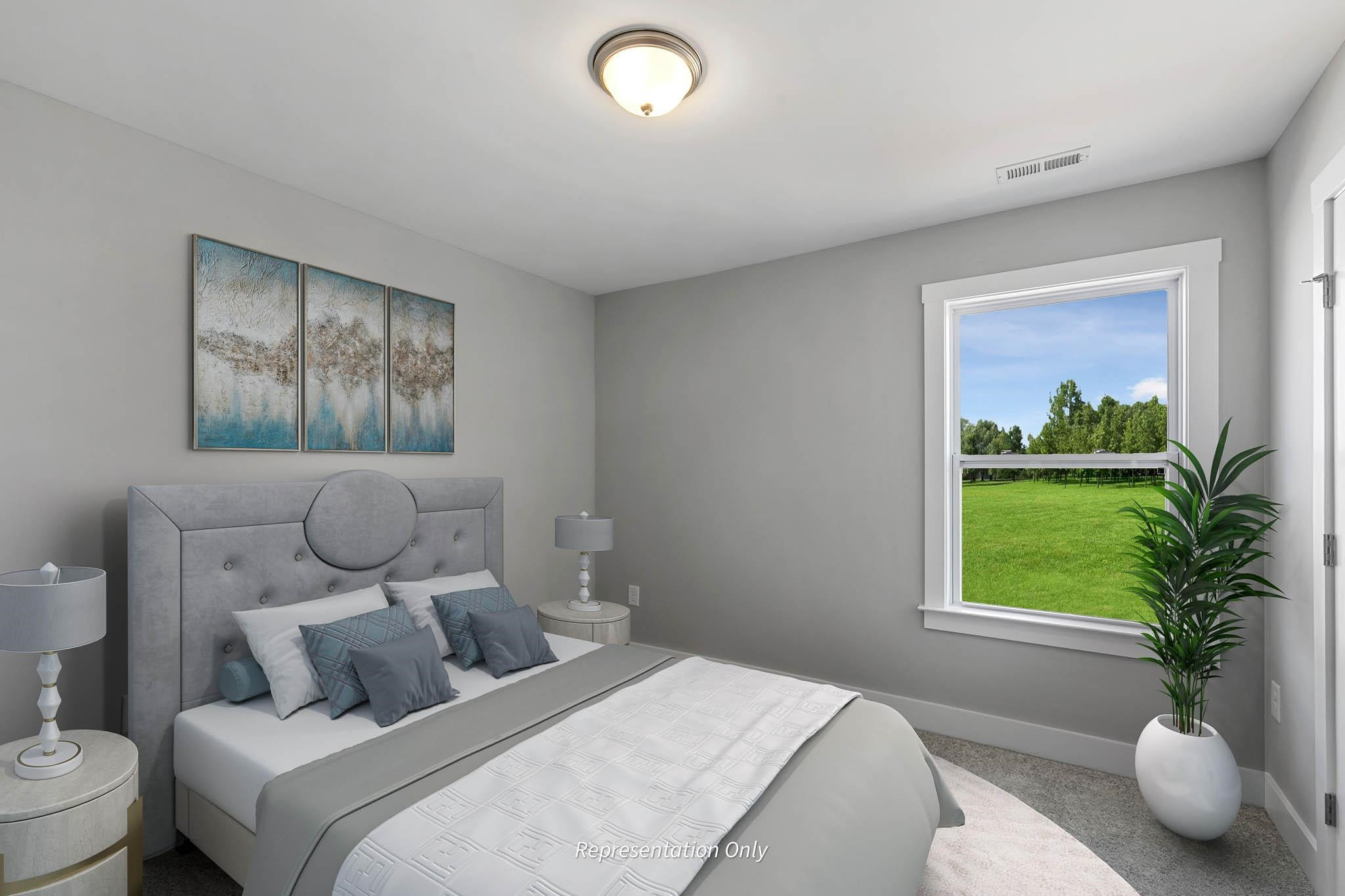 8720 Maxine Street, Unit 3 Willow Spring, NC 27592 - Photo 34 of 35 a bedroom with a bed and a window