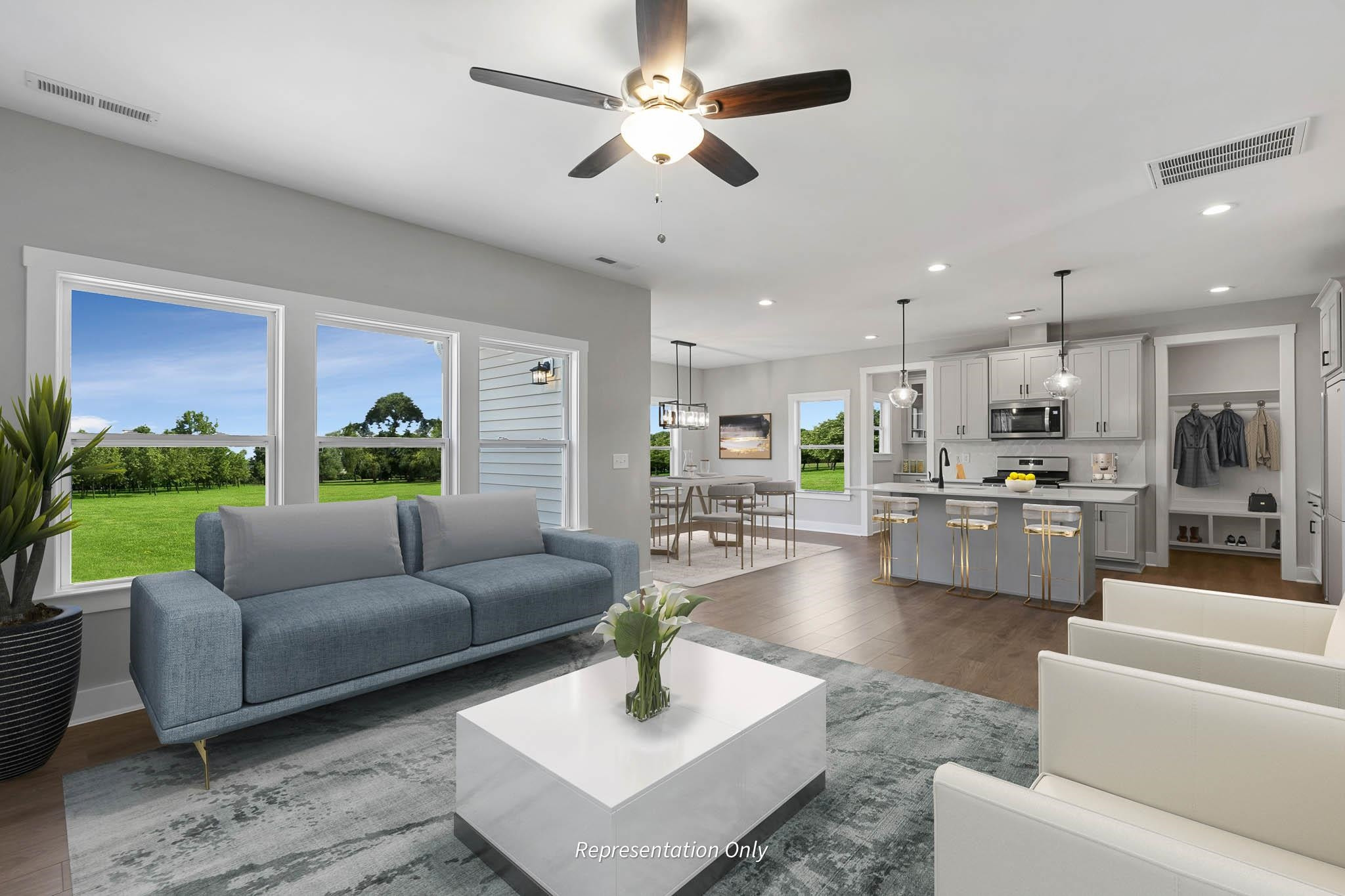 8720 Maxine Street, Unit 3 Willow Spring, NC 27592 - Photo 9 of 35 a living room with furniture and a view of kitchen
