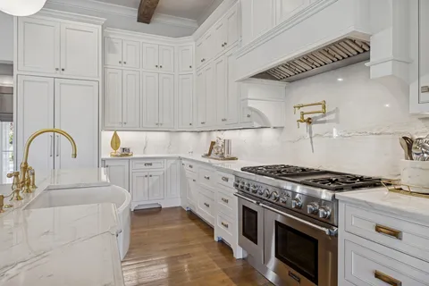 a kitchen with granite countertop a stove and a sink
