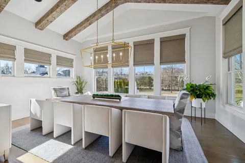 a dining room with a table and chairs